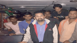 Girish Pant with a group of work­ers in dis­tress